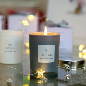 POSITIVE ENERGY MINI CANDLE STILL IN MATT GREY 9cl - In a Christmas setting - The Universal Soul Company